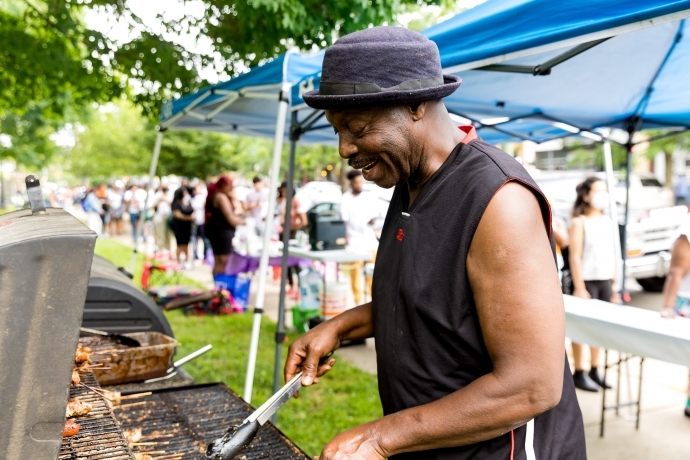 A community vendor cooking up offerings at the June 2022 Dollar Stroll