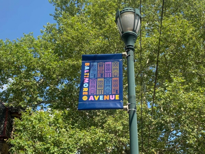 New Baltimore Avenue banners displayed on light poles.