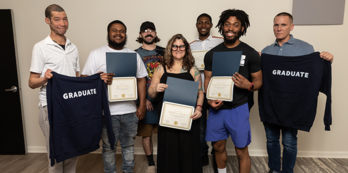 A group of WPSI graduates from a partnership with Philly Shipyard, Inc