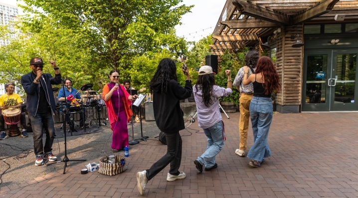 Visitors dance during a musical performance at Trolley Portal Gardens 