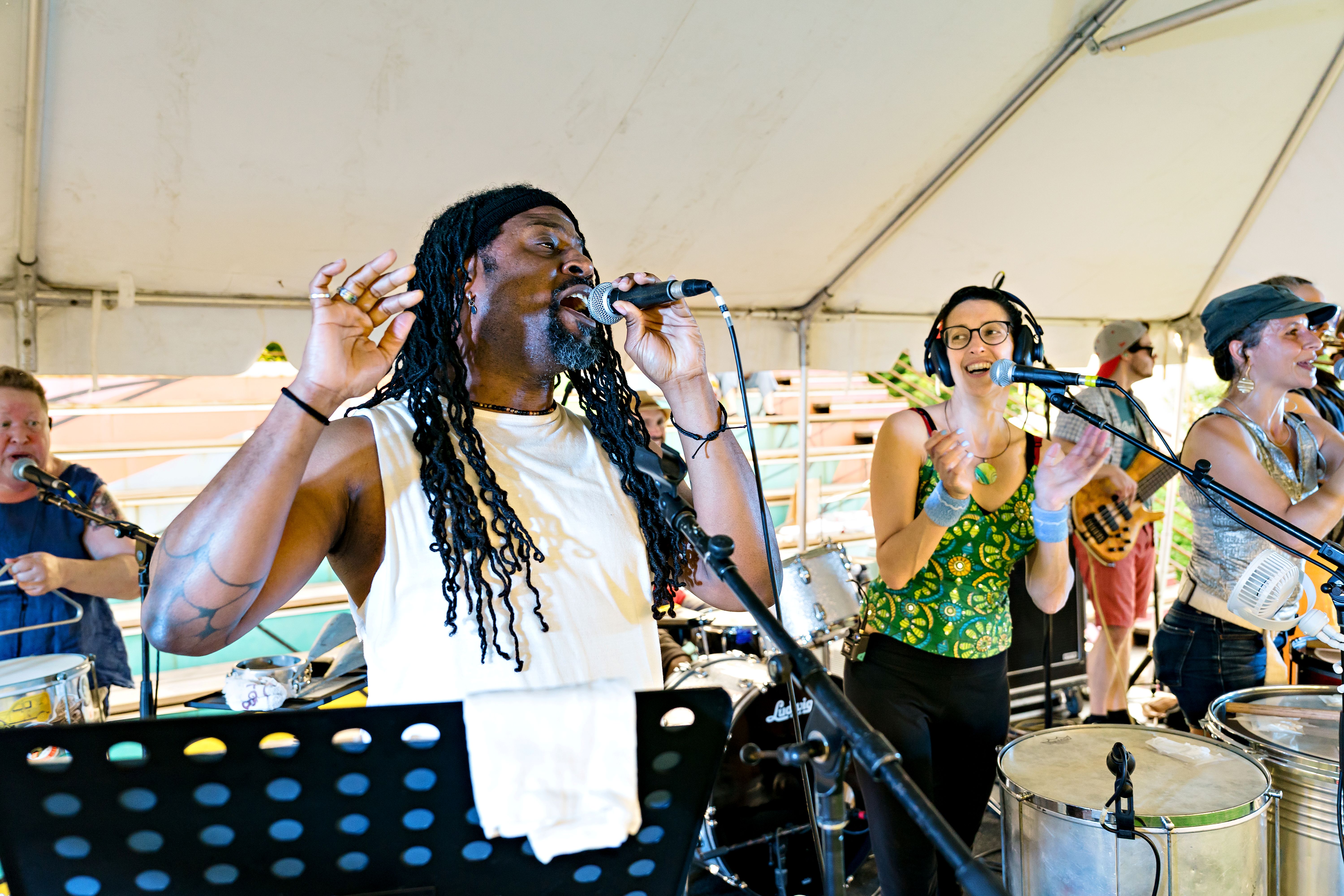 A singer performing with BlocoFunk during the June 12th Summer Series