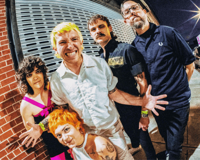 Image of Catbite the band, smiling at the canera