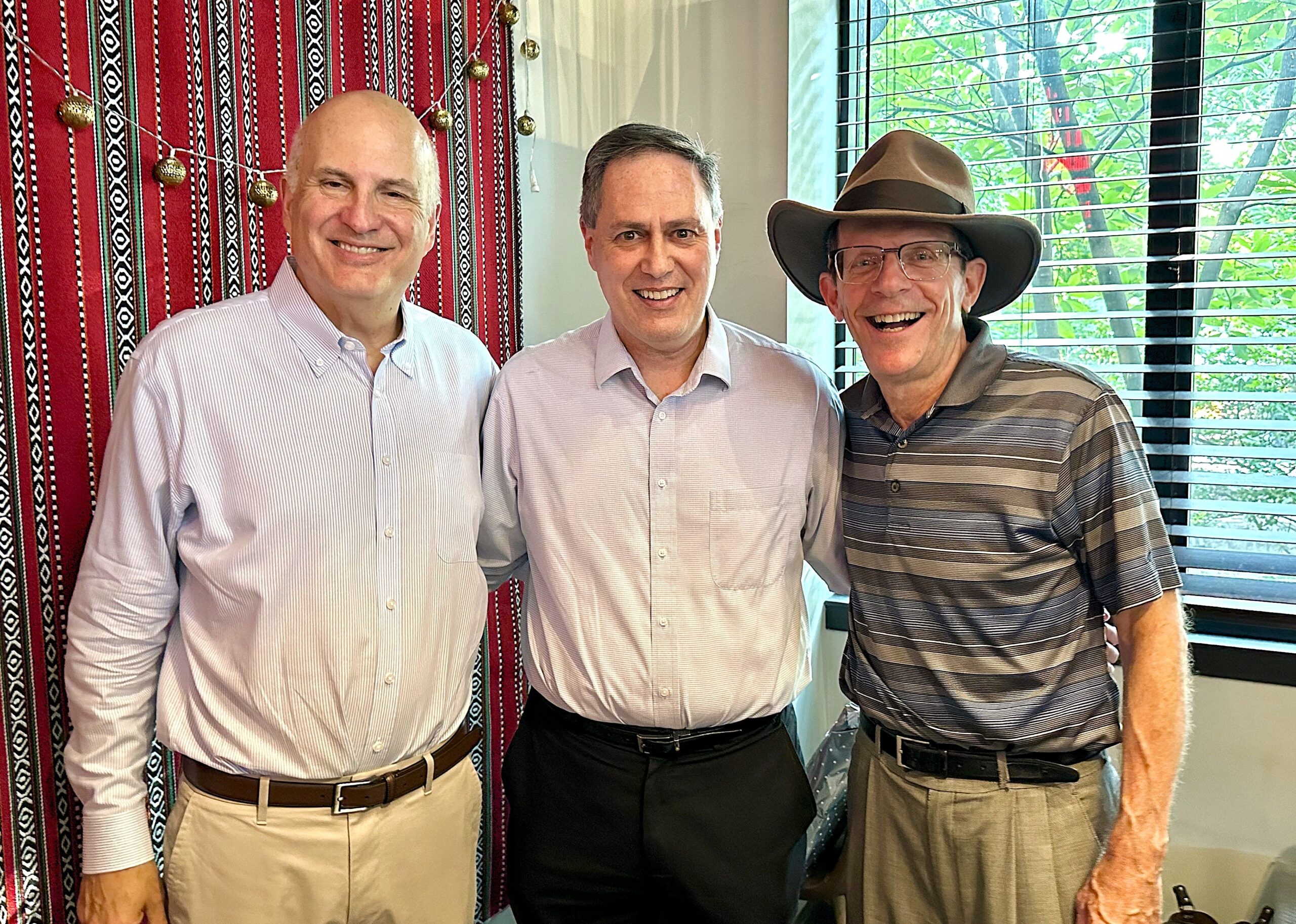 Craig Carnaroli, Matt Bergheiser, and Joe Trainor pose for a photo at Renata's Kitchen
