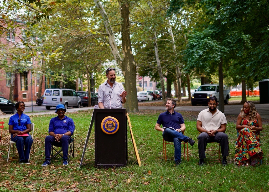 UCD's Nate Hommel speaks during the Clark Park event
