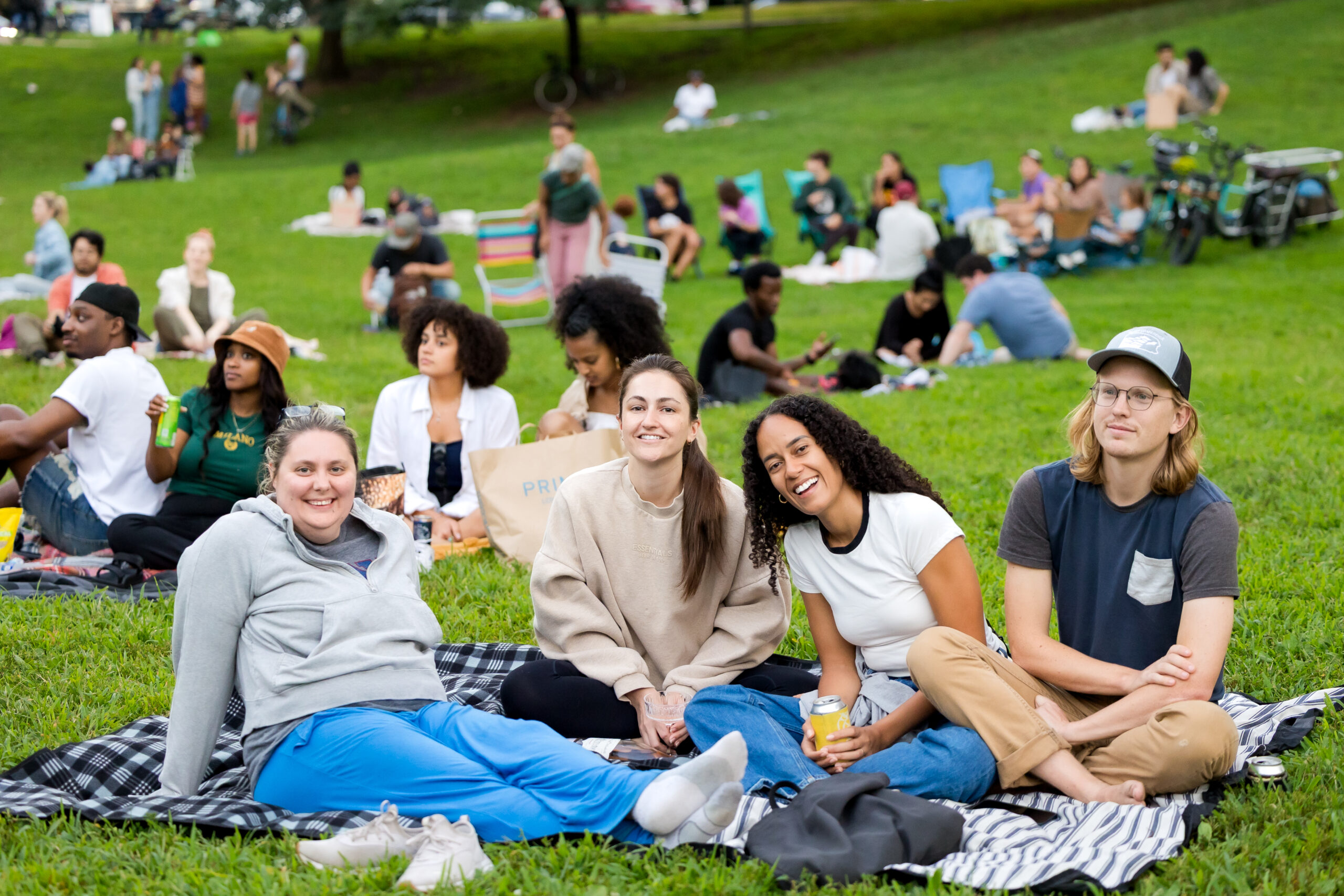 A crowd enjoys an outdoor movie at Movies in Clark Park.