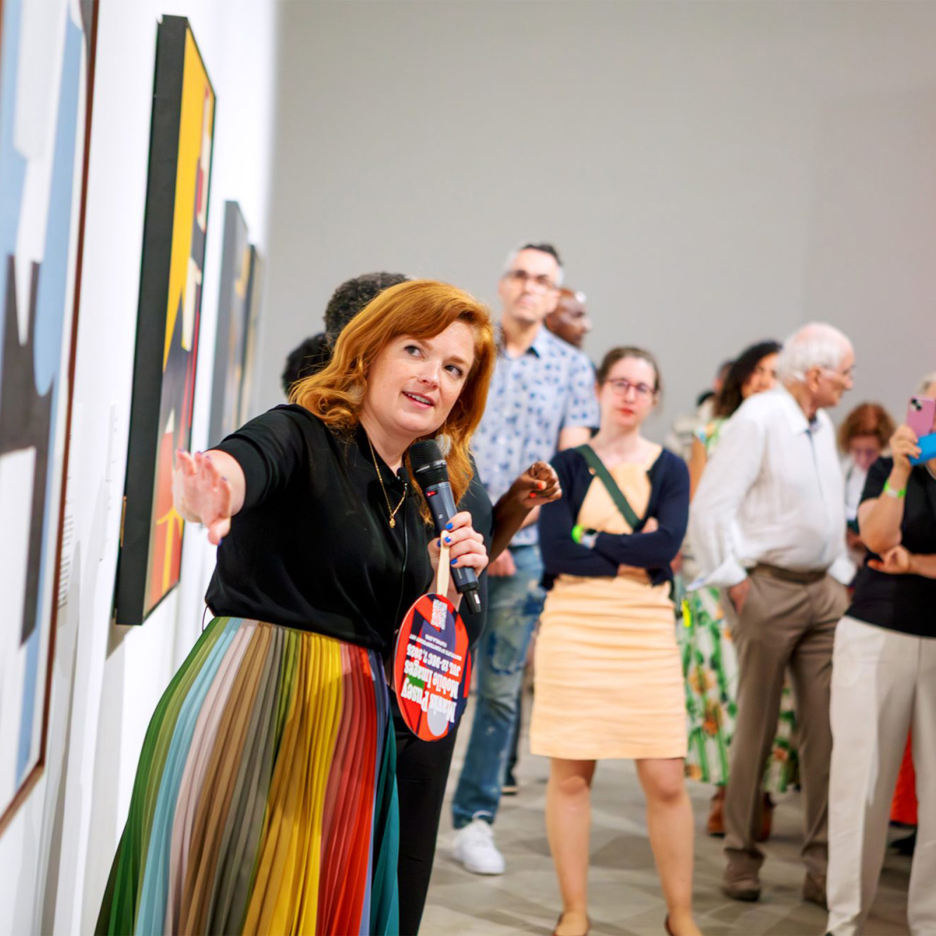 Tour guide leading a group in a museum