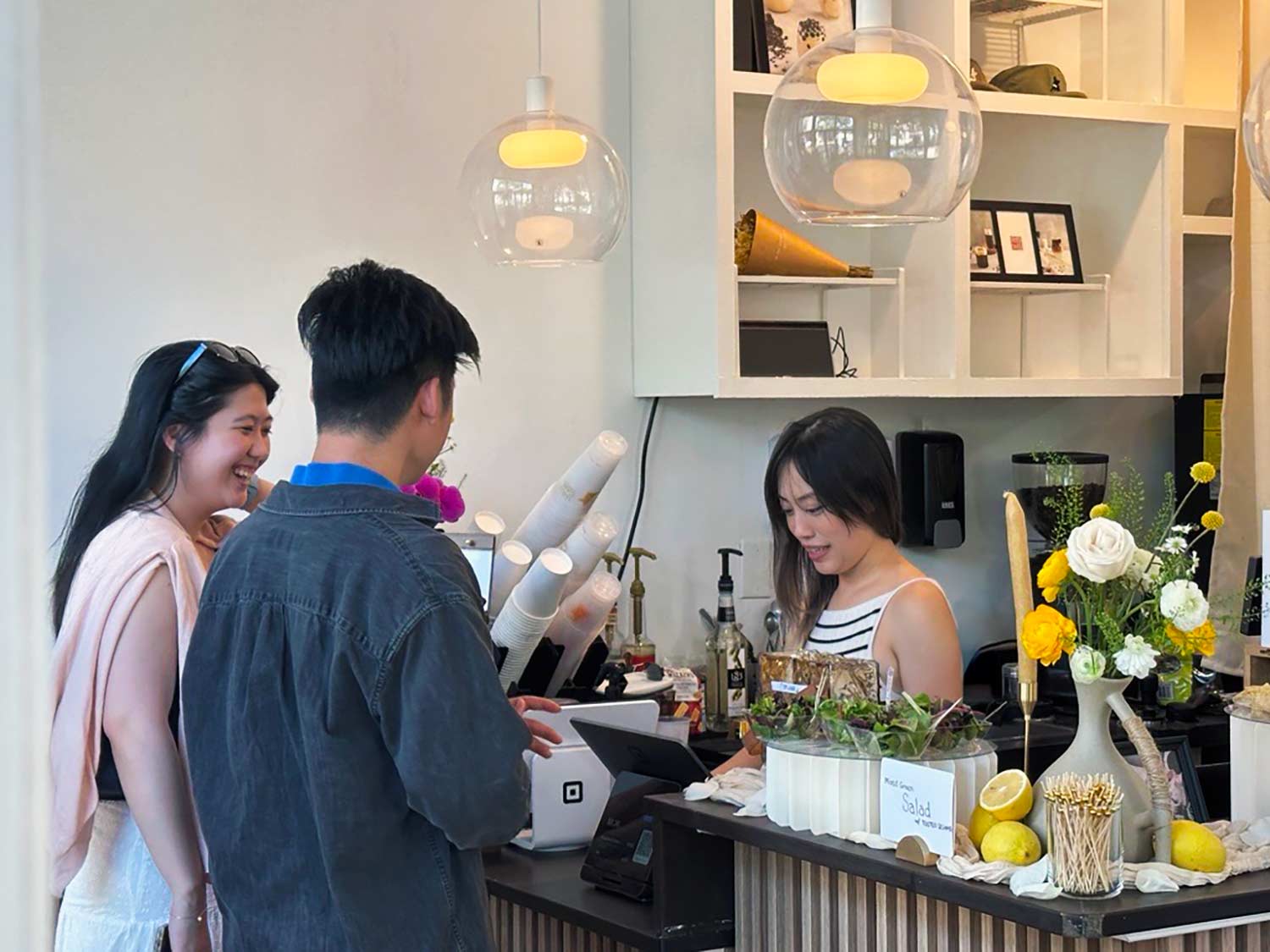 Customers order at the counter of the Lulu Cafe