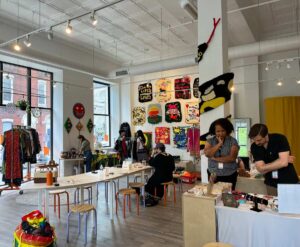 People browse through local art at the Meantime market