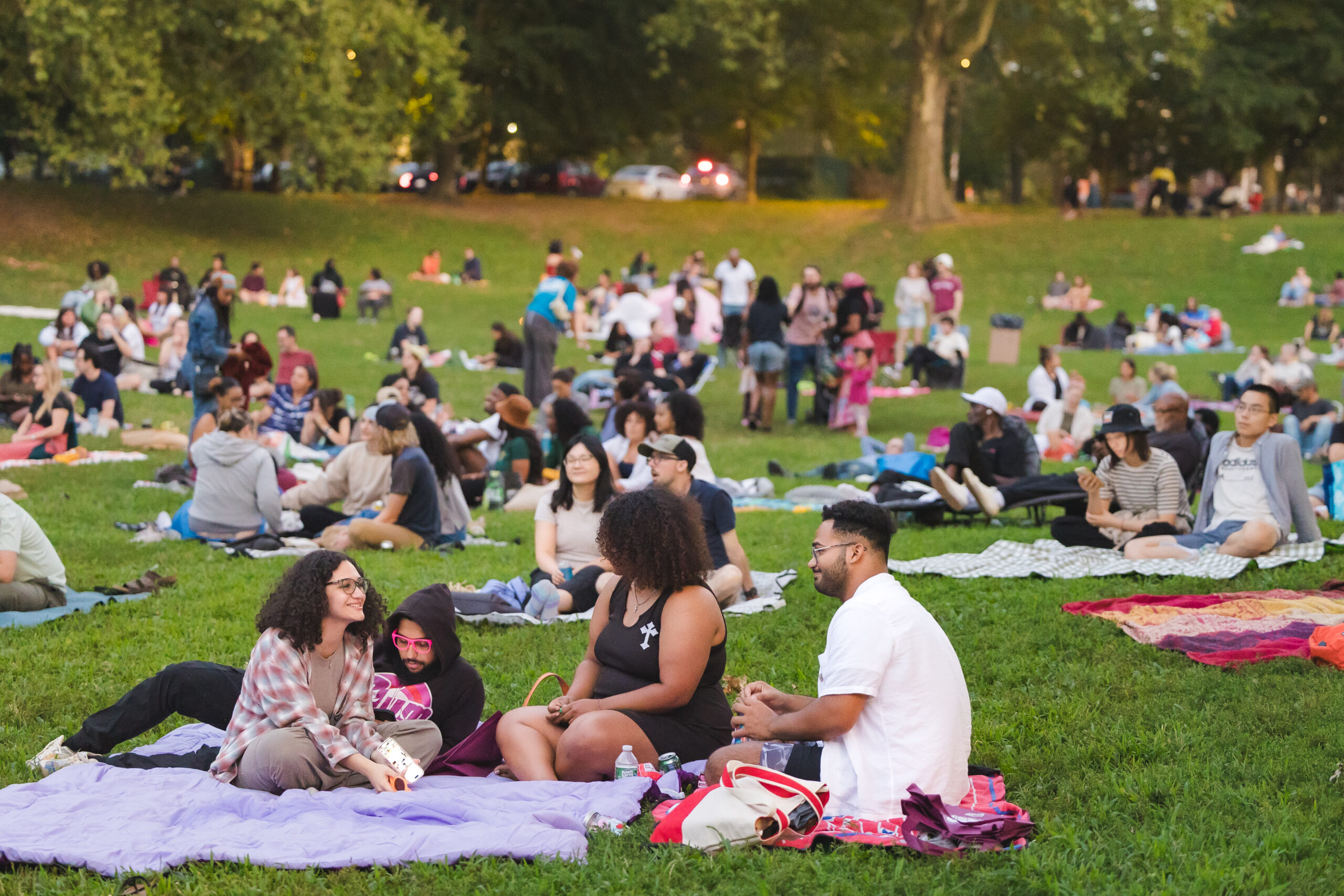 A crowd enjoys an outdoor movie at Movies in Clark Park.