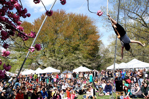 Image of West Craft Fest in the spring, with performances and shoppers.