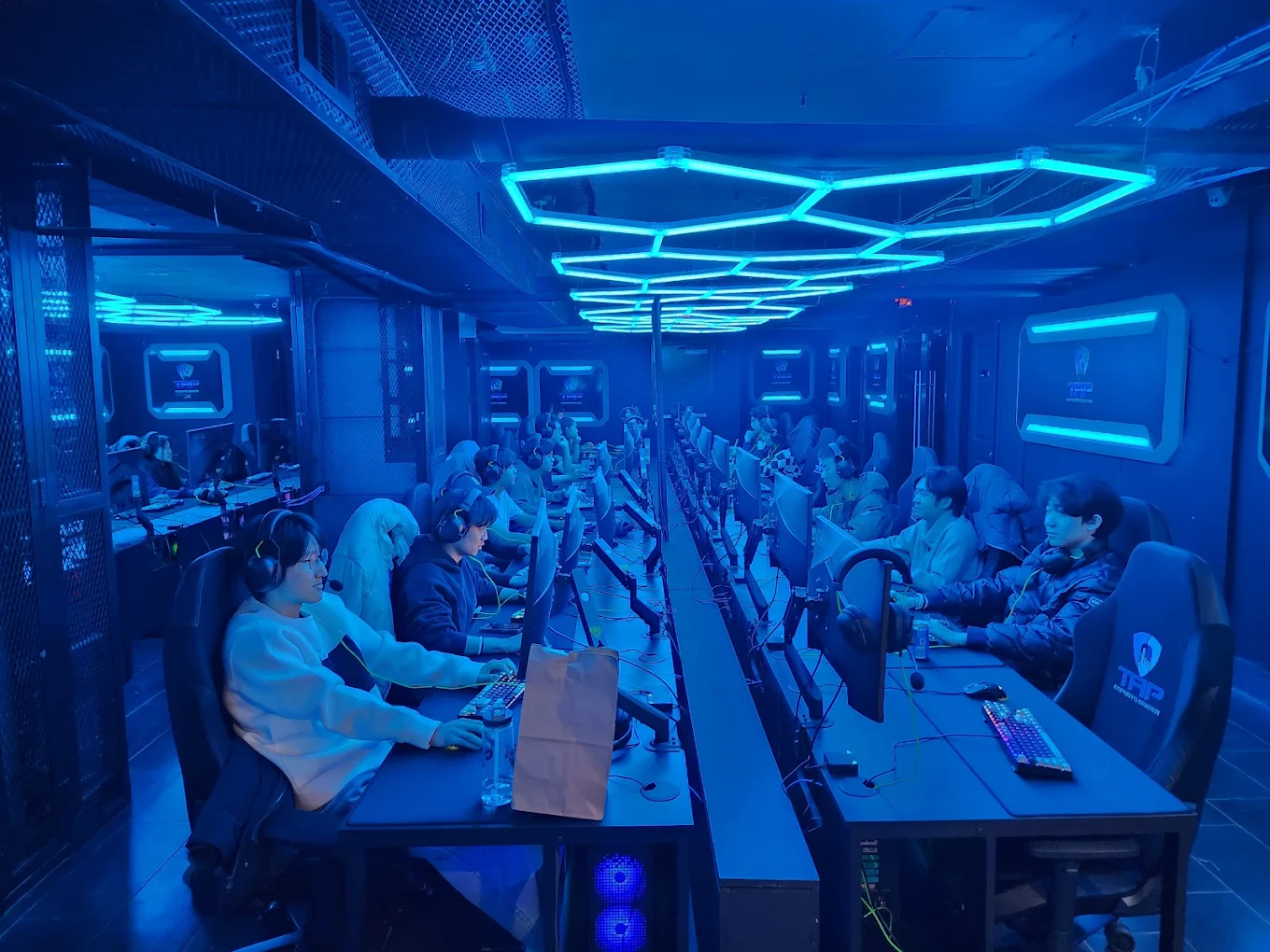 A group of people play games in the new University City ESports Center
