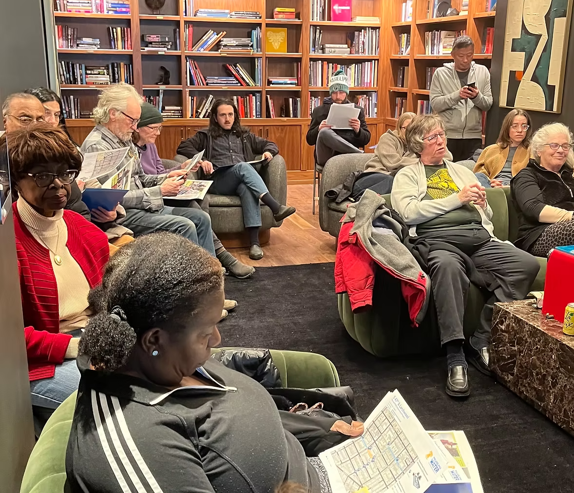 Community members participate in a Garden Court Association community mtg