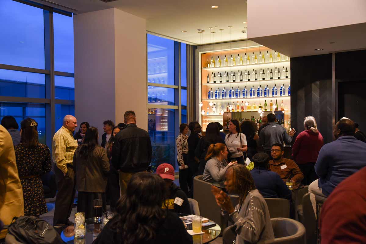 University City Mix Happy Hour crowd socializing at a bar