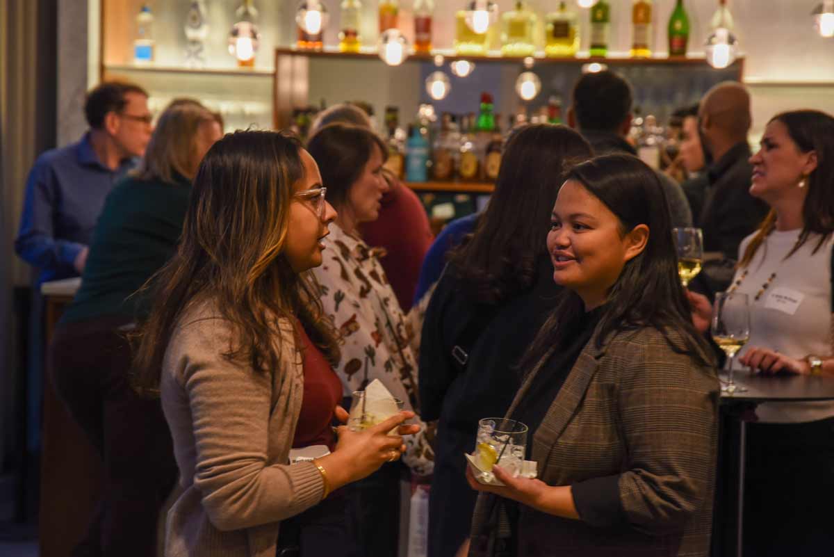 University City Mix Happy Hour crowd socializing at a bar